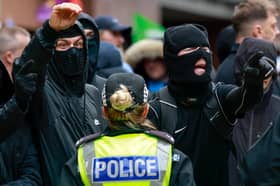 Masked anti-immigration protesters on the streets in Glasgow in June (Picture: Jeff J Mitchell)