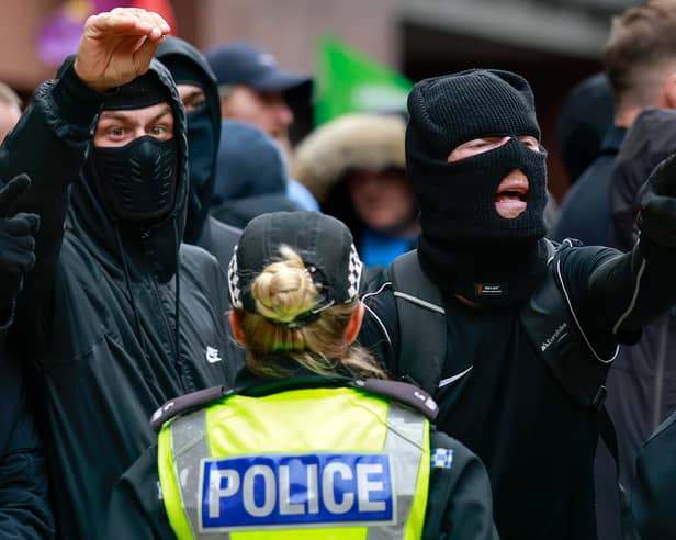 Masked anti-immigration protesters on the streets in Glasgow in June (Picture: Jeff J Mitchell)