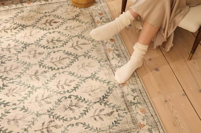 The English Garden rug has a soft recycled-polyester surface and a distressed botanical design. Photo supplied by Hug Rug
