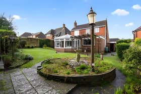 Set within a private cul-de-sac, the detached home enjoys an elevated position that immediately catches the eye.