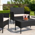 The four-seater rattan garden furniture set includes a sofa, two armchairs and a matching table