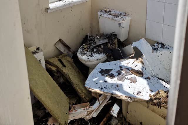 The blaze destroyed the roof of a downstairs bathroom