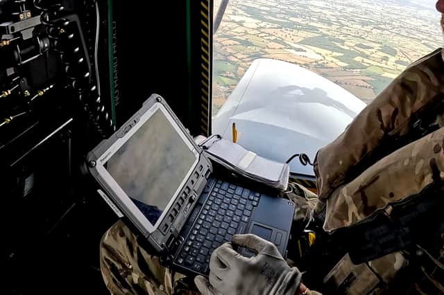 Aircrewman working from the back of a Wildcat Helicopter.
