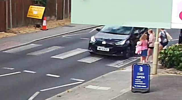 CCTV still of Juliet Mayne with her two daughters and her daughter's friend at the crossing in Portsmouth Road on August 5, 2026. Photo: Richard Habgood