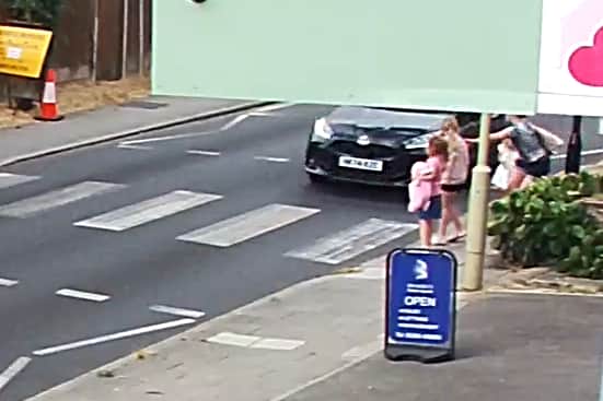 CCTV still of Juliet Mayne with her two daughters and her daughter's friend at the crossing in Portsmouth Road on August 5, 2026. Photo: