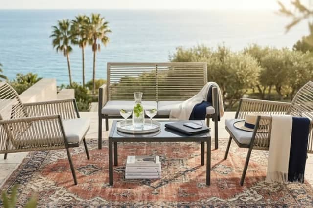 Wowcher’s £199 four-seater rattan garden furniture set includes two chairs, a loveseat and glass-topped table.