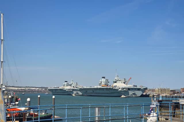 HMS Prince of Wales and HMS Queen Elizabeth alongside HMNB Portsmouth.