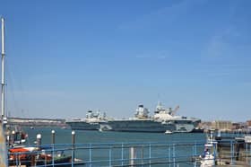 HMS Prince of Wales and HMS Queen Elizabeth alongside HMNB Portsmouth.