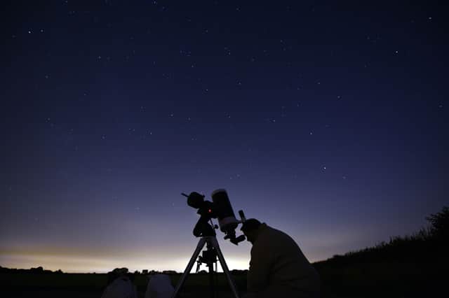 Members of the York Astronomical Society prepare to view the annual Perseids meteor shower in the village of Rufforth, near York, northern England on 12 August 2015.