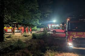 Firefighters have worked through the night to tackle a huge fire that originated from a HGV and spread to nearby heathland. 