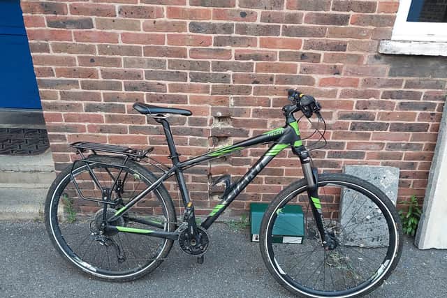 Expensive bikes and e-bikes are being stolen from theft hotspots as thieves conspire with each other to find high value targets. Pictured: A stolen black and green Giant Talon mountain bike recovered from an address in Buckland.