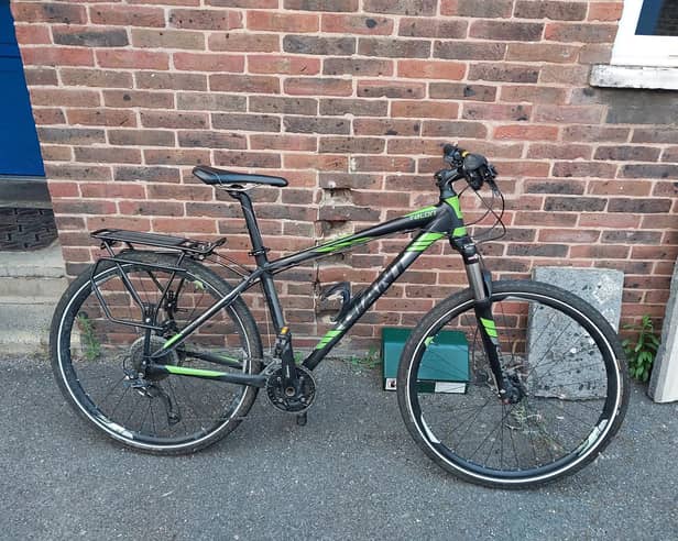 Expensive bikes and e-bikes are being stolen from theft hotspots as thieves conspire with each other to find high value targets. Pictured: A stolen black and green Giant Talon mountain bike recovered from an address in Buckland.
