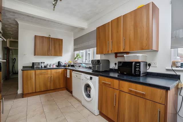 An extended kitchen at the rear provides ample units and workspace for everyday family life