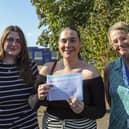 Ruby Andrews-Jukes, centre, got distinction star in health and social care and in law, and a C in criminology. A-levels results day, St Vincent Sixth Form College, Gosport