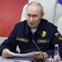 In this pool photograph distributed by the Russian state agency Sputnik, Russia's President Vladimir Putin holds a meeting onboard the Russian Navy's guided missile cruiser Varyag during the final stage of a Pacific Fleet's naval drills on far eastern Sakhalin Island on August 12, 2026. He said British ships will be seized following recent actions by European nations.