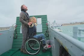 JJ Chalmers and Sophie Morgan being ferried across the water aboard an LCT.
