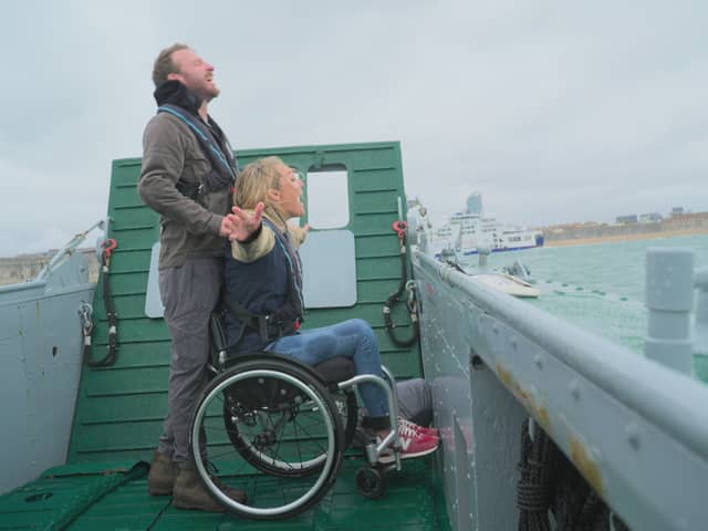 JJ Chalmers and Sophie Morgan being ferried across the water aboard an LCT.