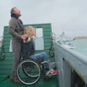 JJ Chalmers and Sophie Morgan being ferried across the water aboard an LCT.