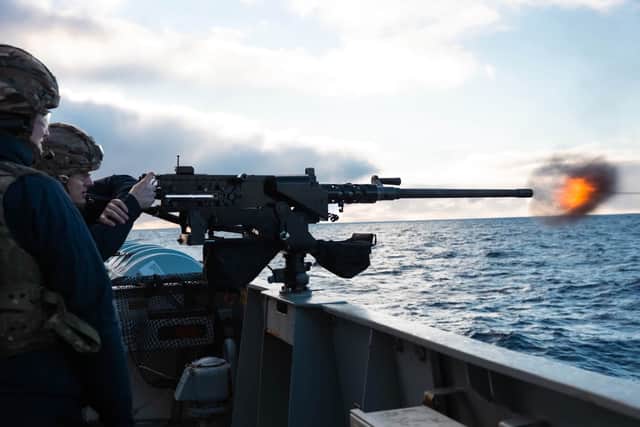 Ship's company aboard HMS Medway firing guns during Operation Southern Vigilance at the edge of the Falkland Islands.