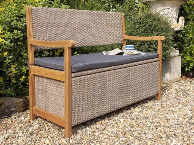 The Rowlinson Alderley bench features a durable hardwood frame, rattan-effect weave and a comfortable seat pad, making it a stylish addition to the garden.