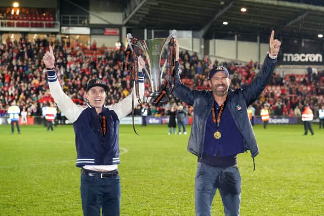 Ryan Mac (left) and Ryan Reynolds have steered Wrexham to to the Championship - and Michael Eisner is ‘a little jealous’ of their Welcome to Wrexham success. Picture: Martin Rickett/PA