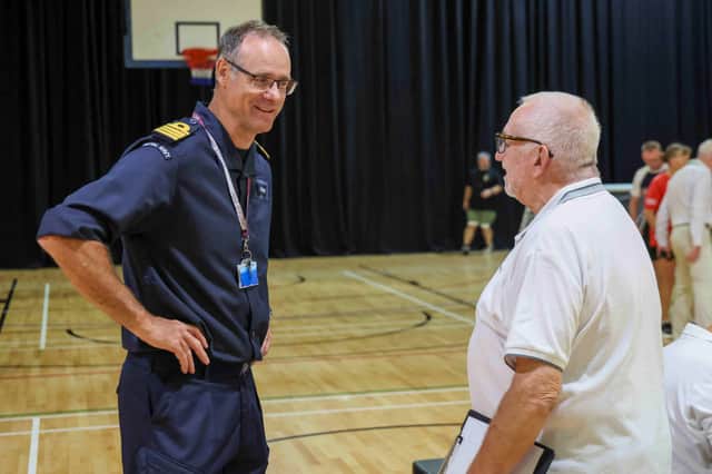 Captain Mark Hamilton, Commanding Officer of HMS Sultan, meets veterans taking part in Sports Day during the Blind Veterans UK Summer Camp.