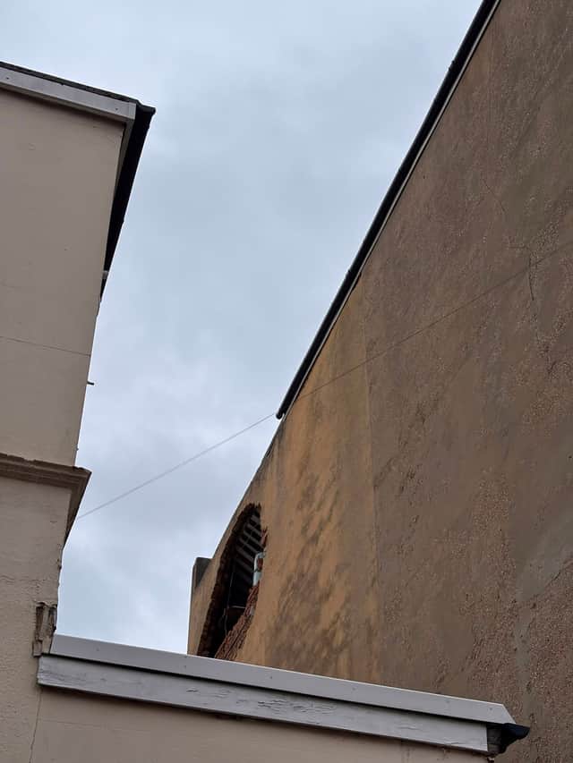 A huge hole can be seen in the external wall of Ophir Court