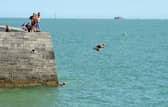 Children and adults were seen tombstoning off the Round Tower and the Hot Walls in Old Portsmouth, on Monday, August 17, 2026.