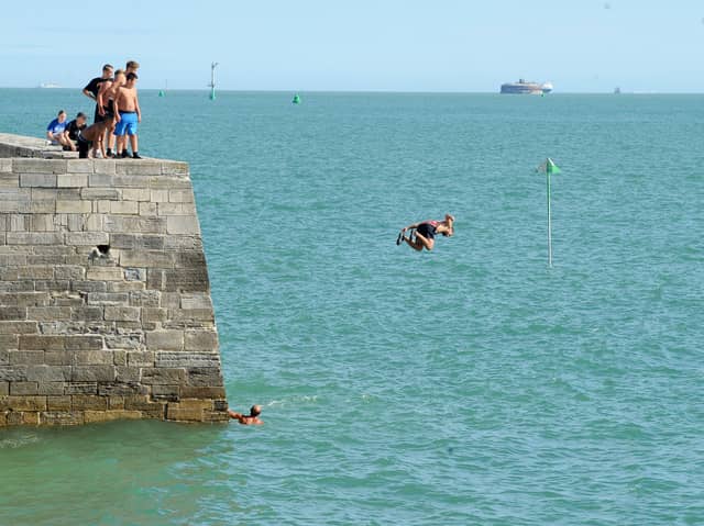 Children and adults were seen tombstoning off the Round Tower and the Hot Walls in Old Portsmouth, on Monday, August 17, 2026.