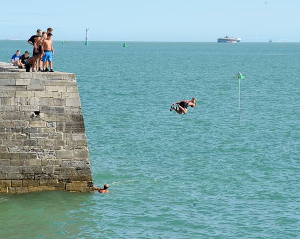 Children and adults were seen tombstoning off the Round Tower and the Hot Walls in Old Portsmouth, on Monday, August 17, 2026.