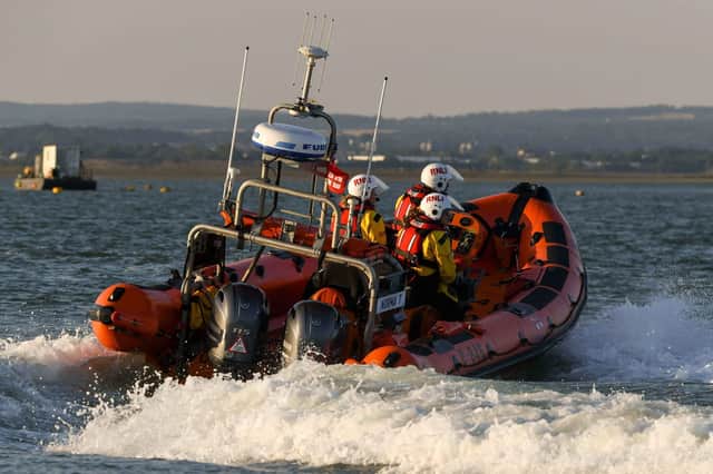 RNLI crews saved brought two people to safety after their vessel was taking on water.