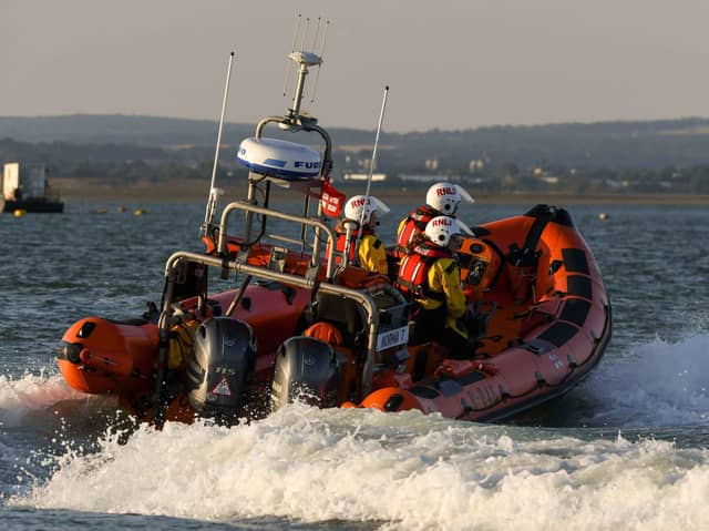 RNLI crews saved brought two people to safety after their vessel was taking on water.
