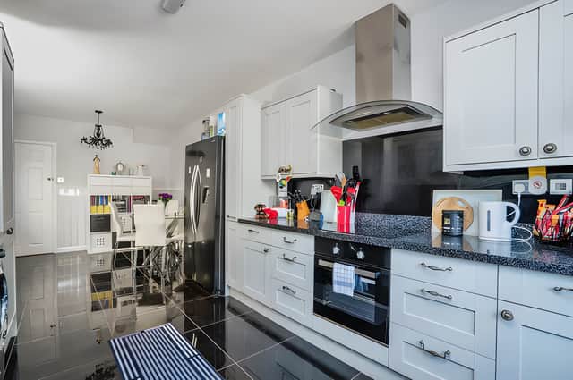 The fitted kitchen sits at the rear of the home and provides direct access to the enclosed garden.