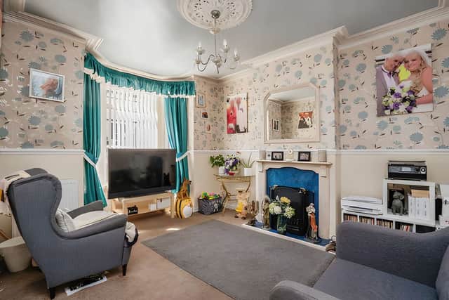 A spacious front reception room features a bay window, creating a characterful main living space.