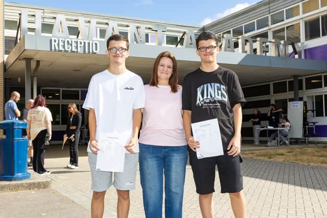 GCSE results day at Havant Academy. 

Pictured: Twins Olly and Kai Slape with proud mum Mandy Wilkinson.


Picture:Marcin Jedrysiak
