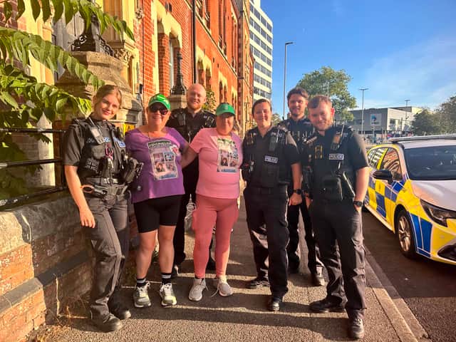 Katie and Kerry with police officers who donated to their cause