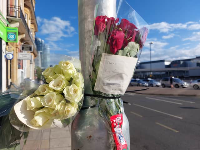 Flowers have been left at the scene of the bus crash