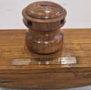Kevin Fitzpatrick is looking to contact a skilled craftsman who made an ink blotter and napkin rings for his family, all made from the original wood of HMS VIctory.
