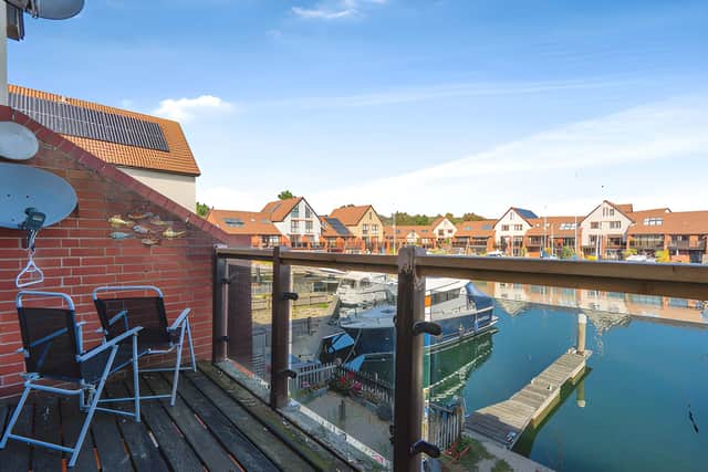 The balcony provides an elevated outdoor setting for enjoying the harbour views, while the property also benefits from direct mooring access