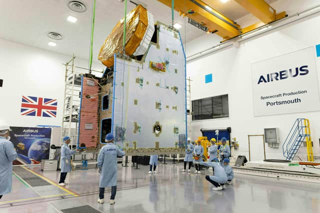 Engineers on the shop floor at one of Airbus Space and Defence's clean rooms in Portsmouth.