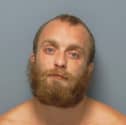 Lewis Dine is wanted by the police after failing to appear at court.
