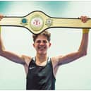 Billy Peck shows off his Ringside Box Cup belt