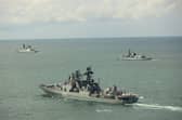 ‘Glaring’ gaps’ in the Royal Navy fleet will make the UK more vulnerable to attacks from Russia in the High North. Pictured: Admiral Levchenko with HMS Duncan (left) and HMS St Albans (right).