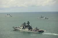 ‘Glaring’ gaps’ in the Royal Navy fleet will make the UK more vulnerable to attacks from Russia in the High North. Pictured: Admiral Levchenko with HMS Duncan (left) and HMS St Albans (right).
