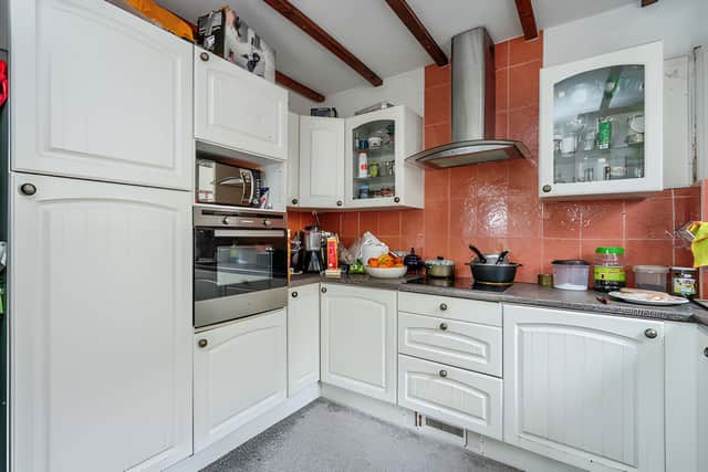 The kitchen has direct access to the garden and offers an opportunity for buyers to create a more modern and practical space