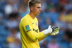 Alex Bass rubs his gloves together