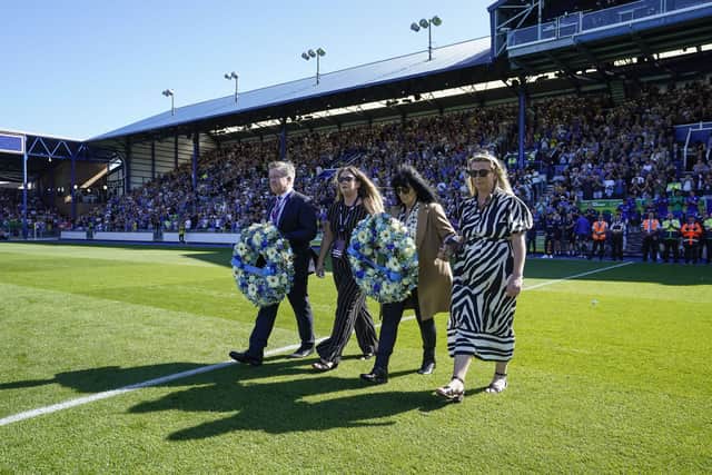 Pompey chief executive Andy Cullen, Alan Knight’s widow Heather and his children Jade and Rebekah pay tribute against Cardiff last weekend. Picture: Jason Brown