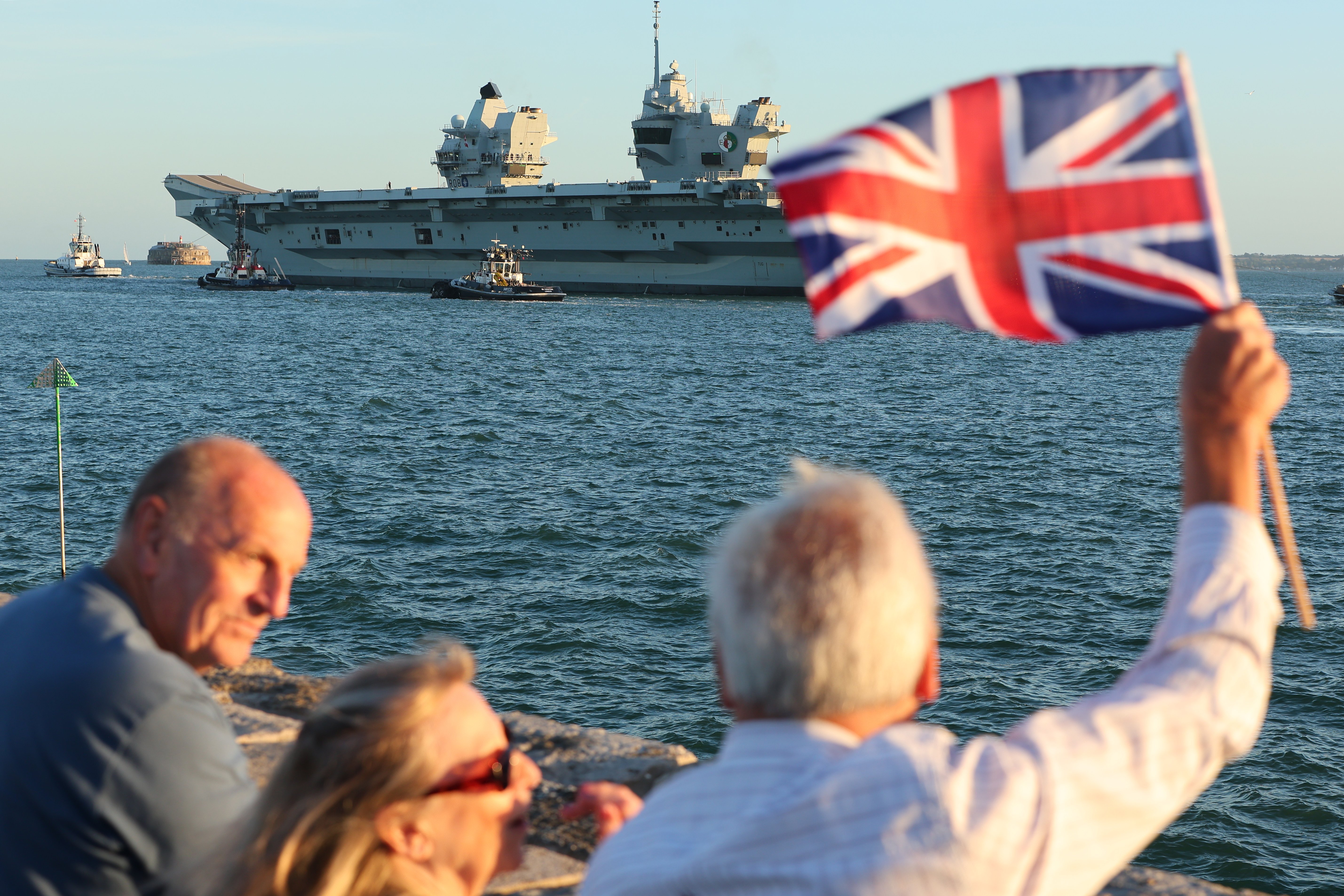 HMS Queen Elizabeth sails out of Portsmouth in 'key milestone' on journey back to the Royal Navy's 'very high readiness' aircraft carrier