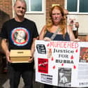 Richard Penfold with the remains of his beloved pet at the vigil for Bubba.