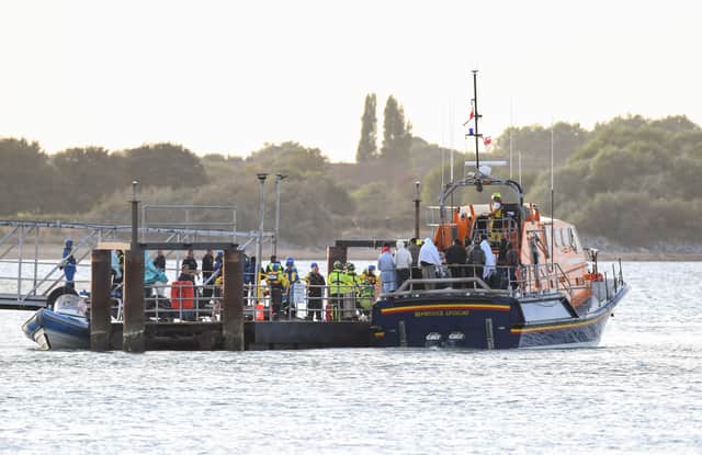 Around 140 migrants arrive in Portsmouth after being transferred from a single dingy south of the Isle of Wight in the English Channel by two RNLI lifeboats, a mammoth operation is talking place on Sunday evening to process the illegal migrants, with dozens of government workers from Police, Border Force, Ambulance and Fire crews, along with a number of transport busses. Viewed from Hayling Island.
Pictures: Paul Jacobs/pictureexclusive.com